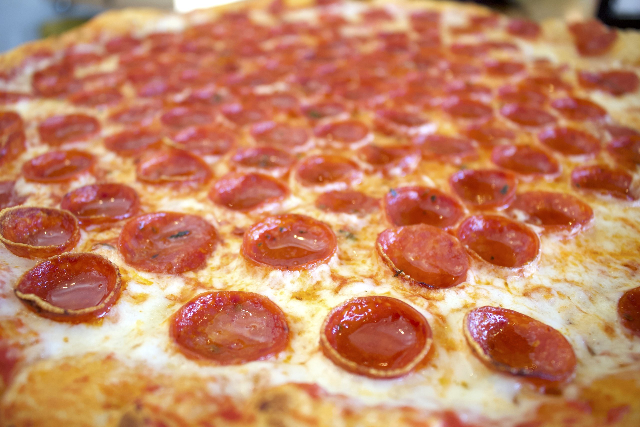 A fresh HomeSlice pepperoni pizza, hot from the oven