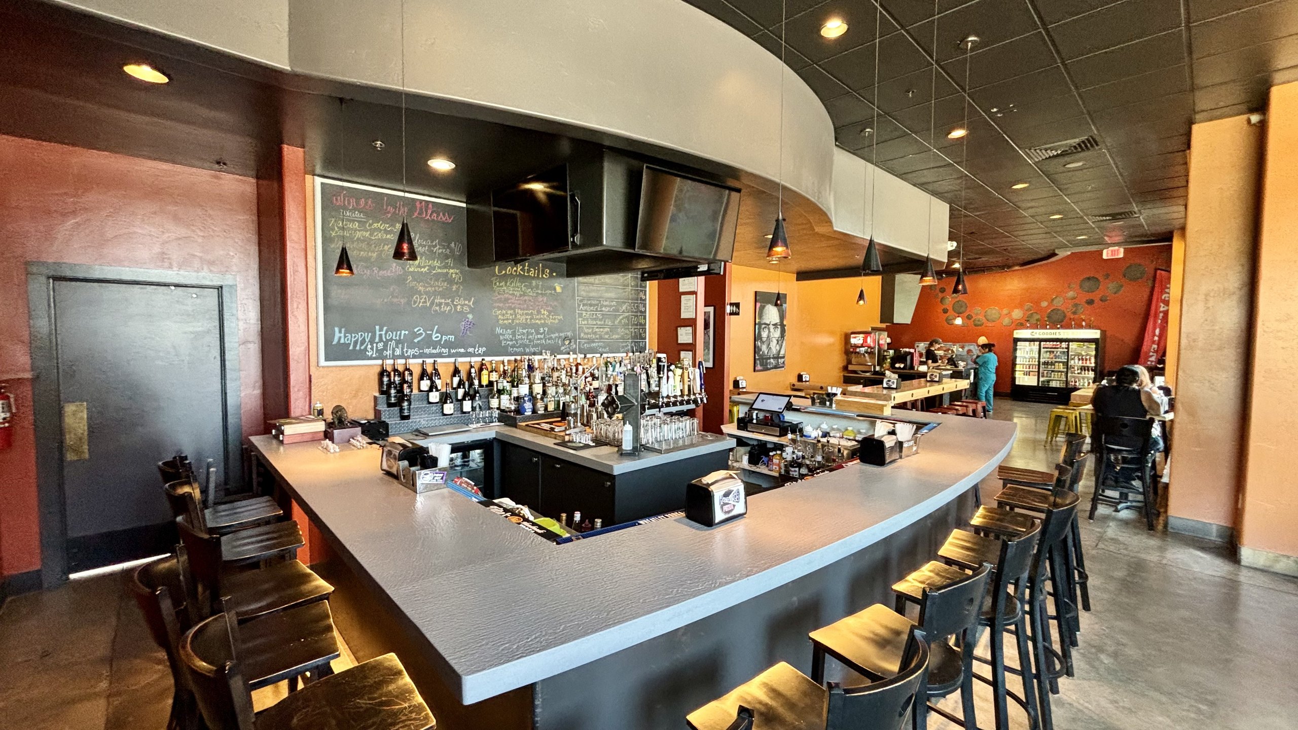 A second view of the curved bar at HomeSlice Pizza Three Springs